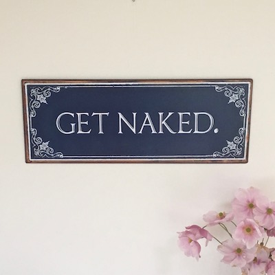 'Get Naked' Vintage Metal Hanging Sign