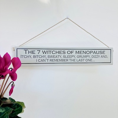 Menopause and painted wooden sign